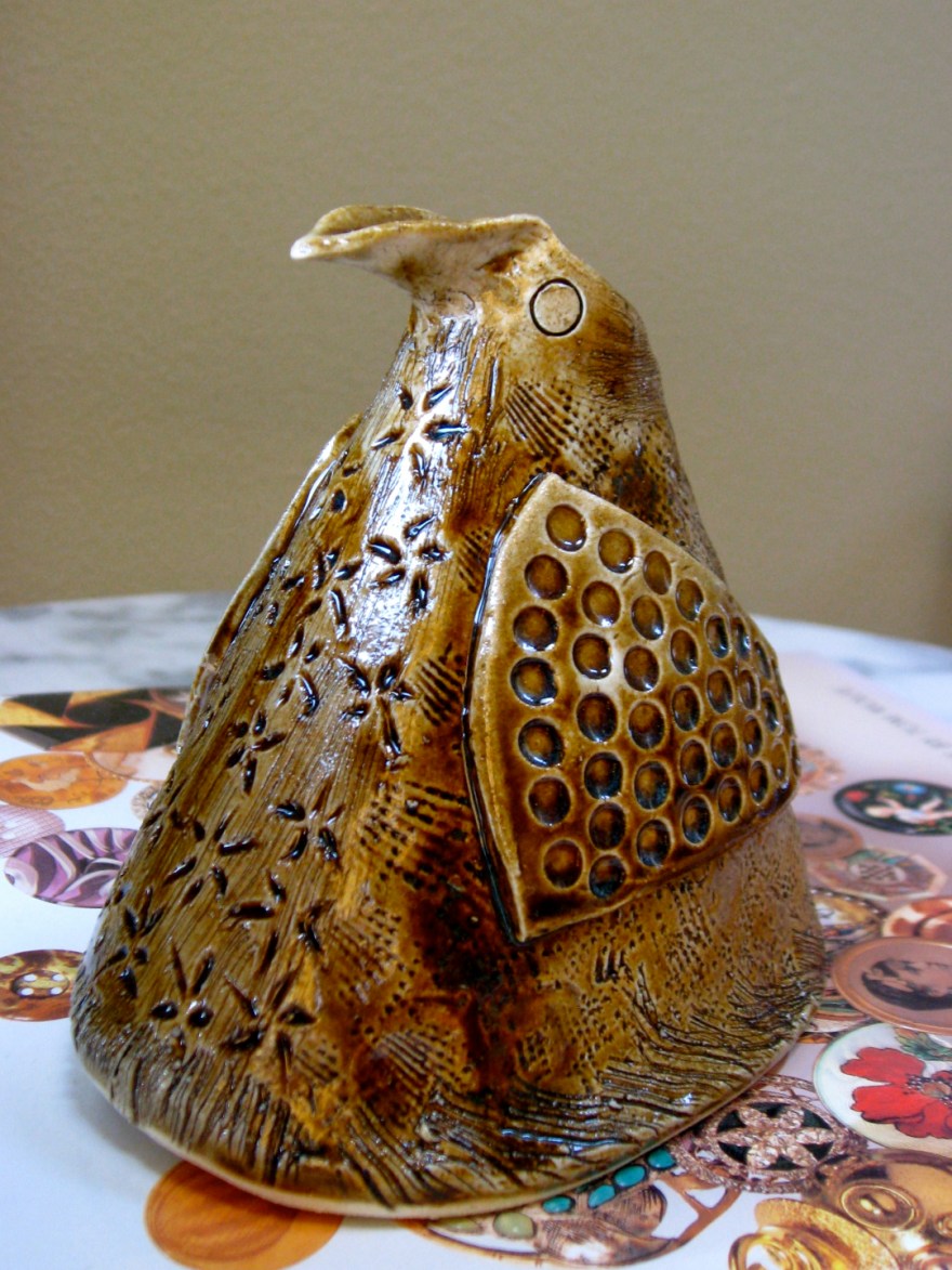 Hand-built ceramic slab with handcarved surface detail.  Commercial glazes on the inside and outside, iron oxide wash, fired to Cone 6. 